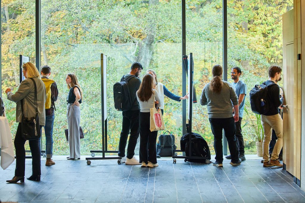 People looking at posters during the conference.